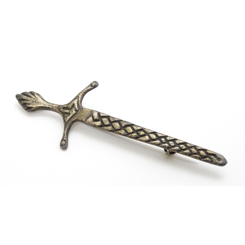 779 - Scottish Iona Jewellery: A silver brooch formed as a Celtic sword marked Iona Scotland Sterling, mak... 