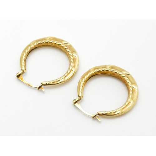 848A - A pair of 9ct gold hoop earrings. Approx 3/4