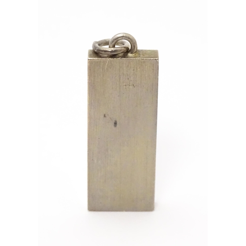 857A - A silver pendant of ingot form hallmarked Birmingham 1977 with Silver Jubilee mark. Approx. 1 7/8