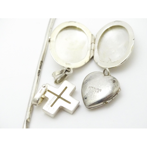 902A - A quantity of silver items to include pendants, earrings, rings, charms, salt spoon, etc. To include... 