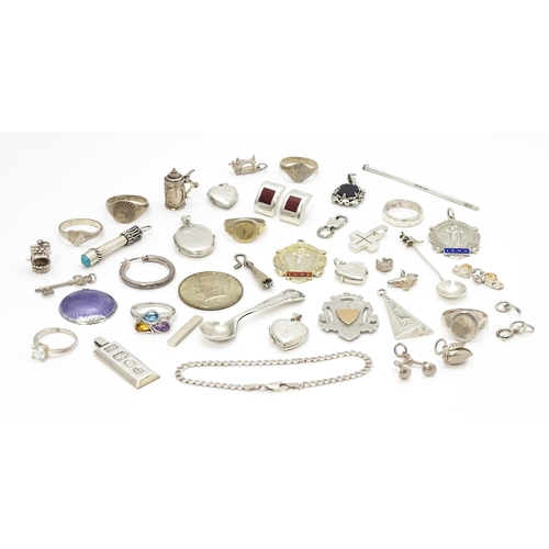 902A - A quantity of silver items to include pendants, earrings, rings, charms, salt spoon, etc. To include... 