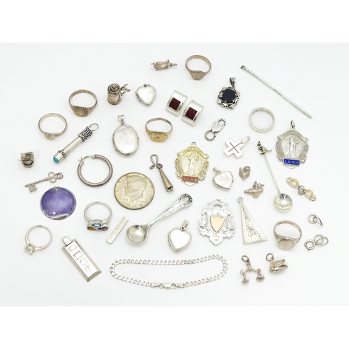 902A - A quantity of silver items to include pendants, earrings, rings, charms, salt spoon, etc. To include... 