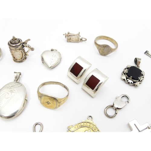 902A - A quantity of silver items to include pendants, earrings, rings, charms, salt spoon, etc. To include... 