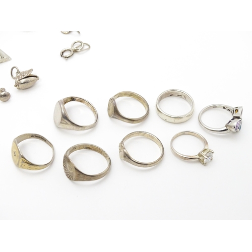 902A - A quantity of silver items to include pendants, earrings, rings, charms, salt spoon, etc. To include... 