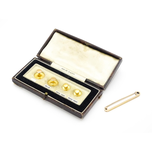 916A - A 9ct gold bar brooch. Together with cased dress studs. Brooch approx. 2