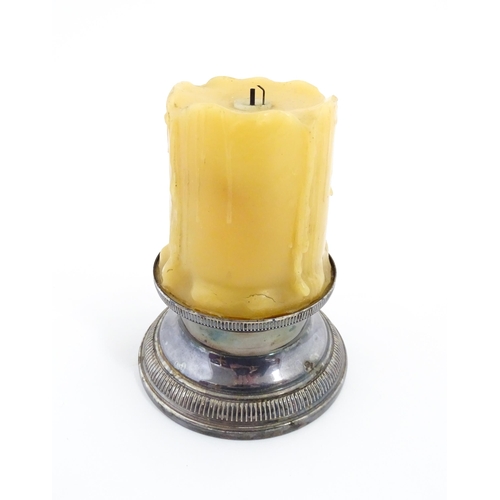 1098 - A 20thC French novelty table lighter modelled as a candle with a silver plate base. Marked under Bri... 