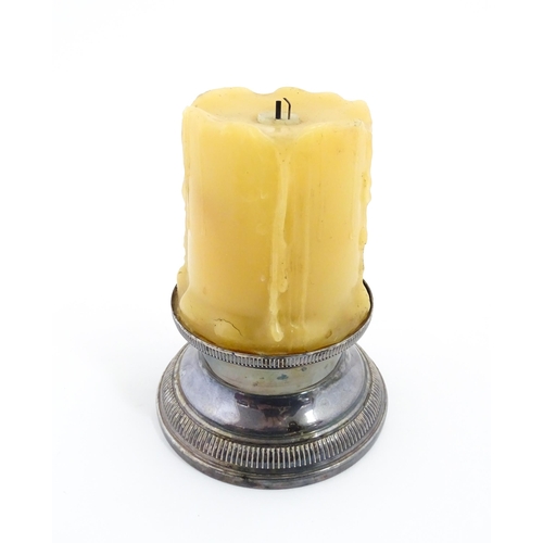 1098 - A 20thC French novelty table lighter modelled as a candle with a silver plate base. Marked under Bri... 