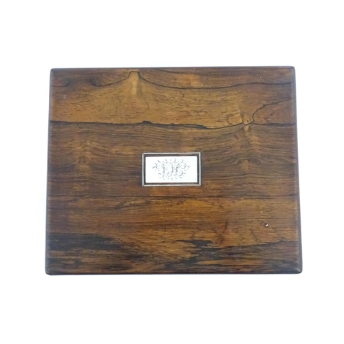 1286 - A Victorian rosewood workbox with inlaid mother of pearl escutcheon and plaque to top, opening to re... 