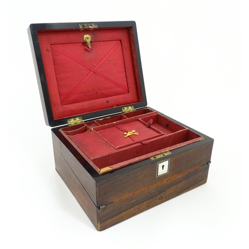 1286 - A Victorian rosewood workbox with inlaid mother of pearl escutcheon and plaque to top, opening to re... 