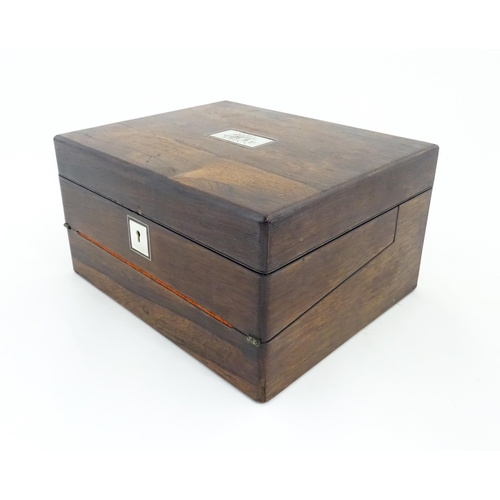 1286 - A Victorian rosewood workbox with inlaid mother of pearl escutcheon and plaque to top, opening to re... 