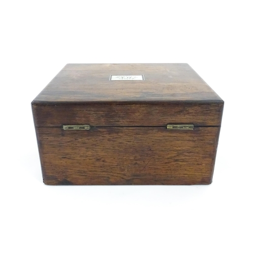 1286 - A Victorian rosewood workbox with inlaid mother of pearl escutcheon and plaque to top, opening to re... 