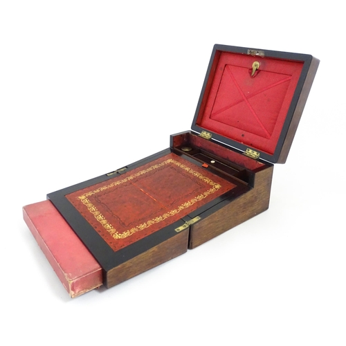 1286 - A Victorian rosewood workbox with inlaid mother of pearl escutcheon and plaque to top, opening to re... 