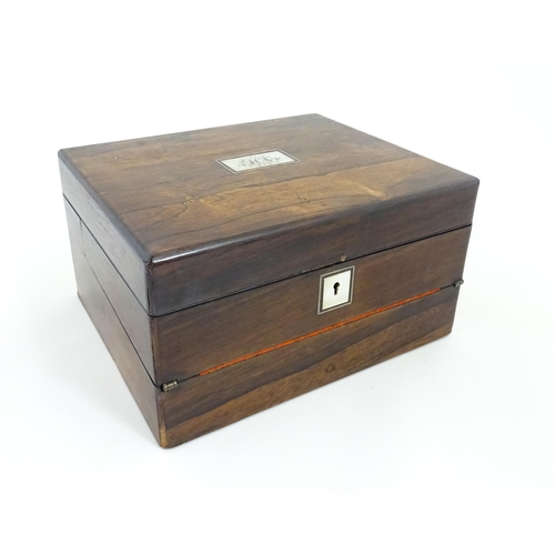 1286 - A Victorian rosewood workbox with inlaid mother of pearl escutcheon and plaque to top, opening to re... 