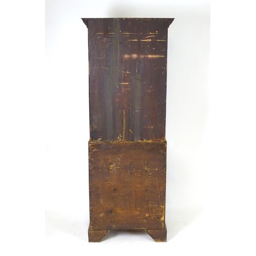 1533 - A mid 18thC mahogany bureau bookcase with a moulded cornice above a dentil frieze and shaped mirrore... 