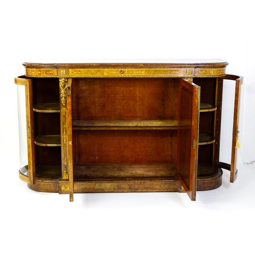 1544 - A Victorian burr walnut credenza with a bowed front and moulded top above an intricately inlaid stru... 