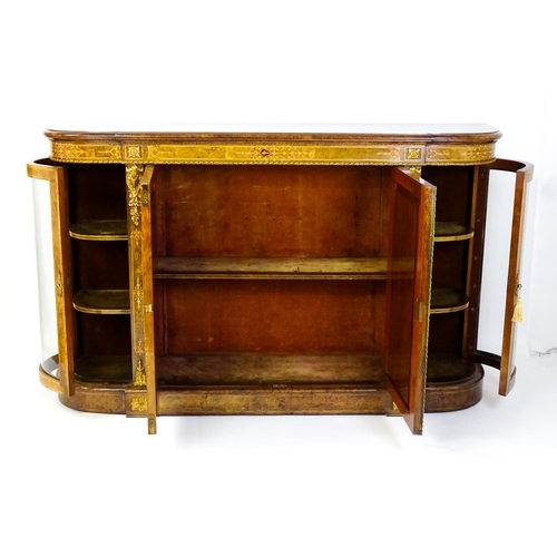 1544 - A Victorian burr walnut credenza with a bowed front and moulded top above an intricately inlaid stru... 