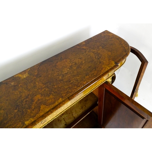 1544 - A Victorian burr walnut credenza with a bowed front and moulded top above an intricately inlaid stru... 