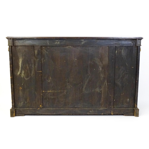 1544 - A Victorian burr walnut credenza with a bowed front and moulded top above an intricately inlaid stru... 