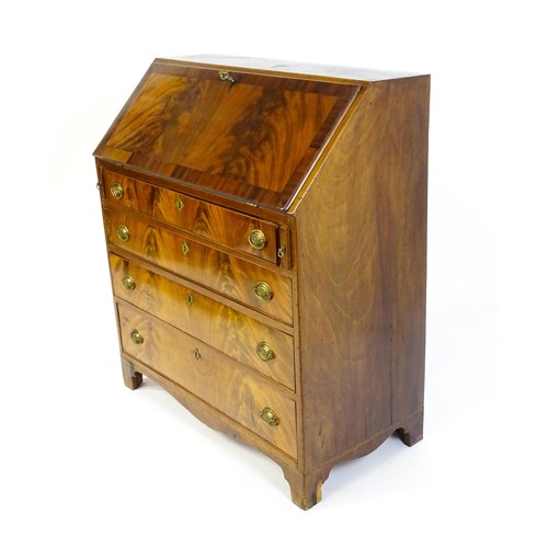 1575 - An early 19thC mahogany bureau with a fall front above four long graduated drawers with brass back p... 