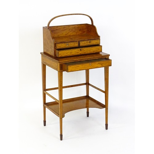 1658 - A 19thC satinwood Bonheur du jour, the removeable top having an arched carrying handle and three sma... 