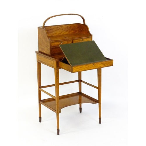 1658 - A 19thC satinwood Bonheur du jour, the removeable top having an arched carrying handle and three sma... 