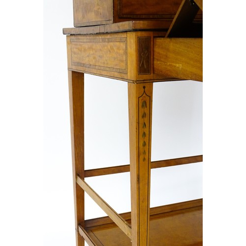 1658 - A 19thC satinwood Bonheur du jour, the removeable top having an arched carrying handle and three sma... 