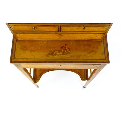 1658 - A 19thC satinwood Bonheur du jour, the removeable top having an arched carrying handle and three sma... 