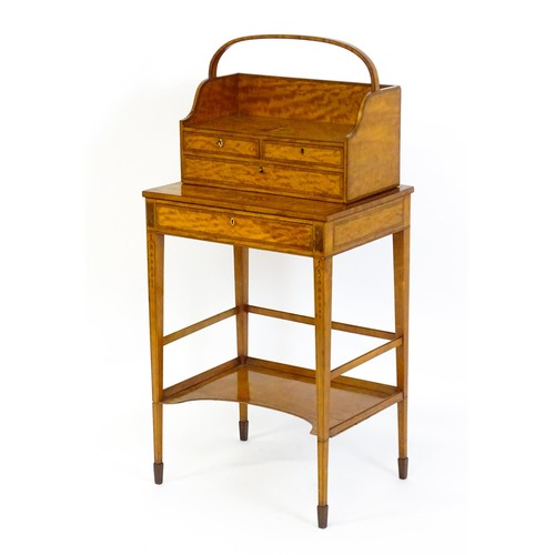 1658 - A 19thC satinwood Bonheur du jour, the removeable top having an arched carrying handle and three sma... 