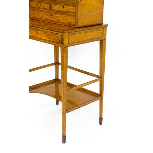 1658 - A 19thC satinwood Bonheur du jour, the removeable top having an arched carrying handle and three sma... 