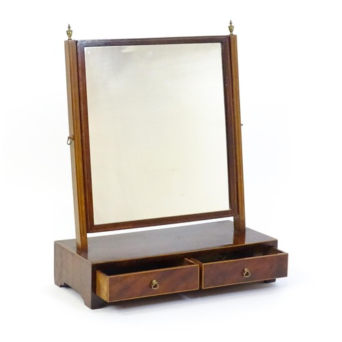 1663 - A late 19thC walnut toilet mirror / dressing mirror with satinwood inlay and surmounted by brass fin... 