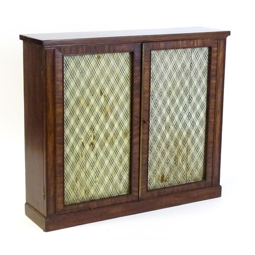 1666 - An early 19thC mahogany cabinet with a rectangular top above two grilled doors fitted with a fabric ... 