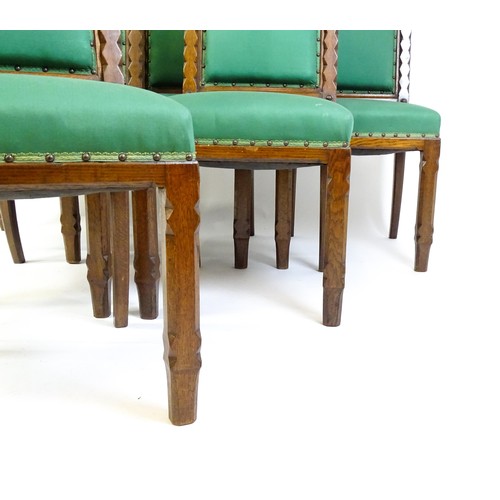 1699 - A set of six 19thC Gothic oak dining chairs , the upright supports having trefoil capitals flanking ... 