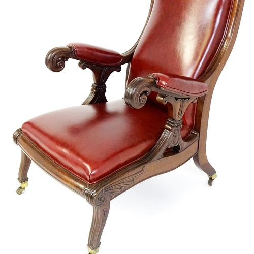 1700 - A Regency period mahogany armchair with a moulded and floral carved frame, having a shaped backrest ... 