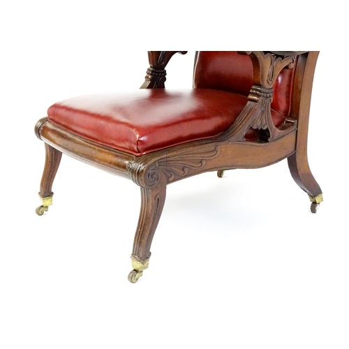 1700 - A Regency period mahogany armchair with a moulded and floral carved frame, having a shaped backrest ... 