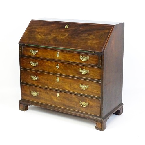 1709 - A mid 18thC mahogany bureau with a fall front above four long graduated drawer, the fall front fitte... 