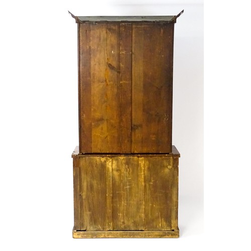 1714 - A Victorian mahogany chiffonier bookcase, the top having a moulded cornice above glazed doors flanke... 