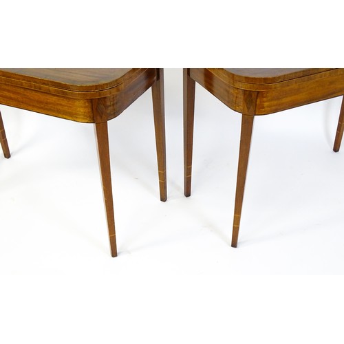 1717 - A pair of Regency mahogany tea tables, both with hinged and rotating crossbanded tops raised on four... 