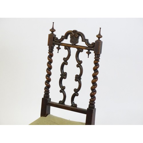 1721 - A Victorian rosewood side chair surmounted by turned finials and having barley twist uprights, the c... 