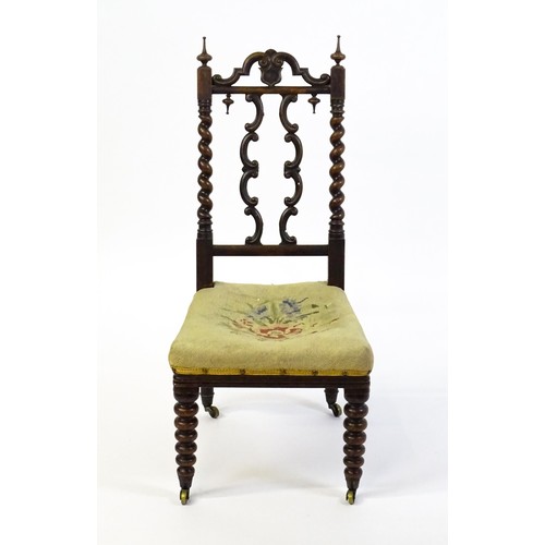 1721 - A Victorian rosewood side chair surmounted by turned finials and having barley twist uprights, the c... 