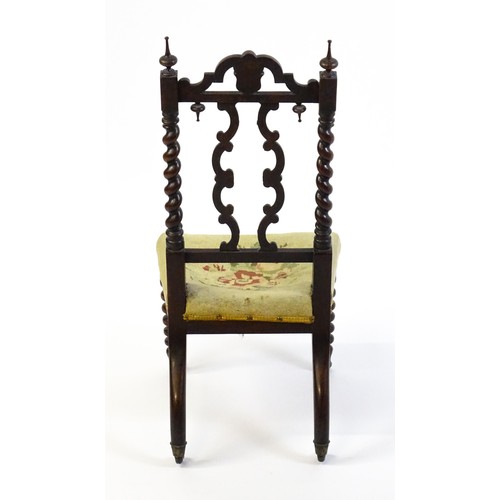 1721 - A Victorian rosewood side chair surmounted by turned finials and having barley twist uprights, the c... 