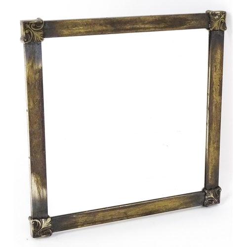 1725 - A mid 20thC brass mirror with floral mouldings to the corner. 21