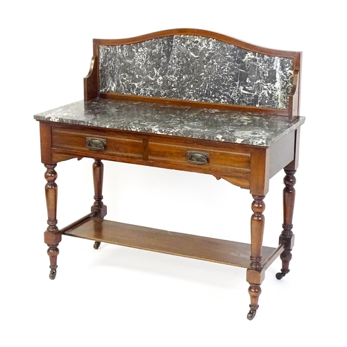 1727 - A late 19thC / early 20thC washstand, with a marble splashback and matching marble top above two sho... 