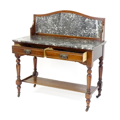 1727 - A late 19thC / early 20thC washstand, with a marble splashback and matching marble top above two sho... 