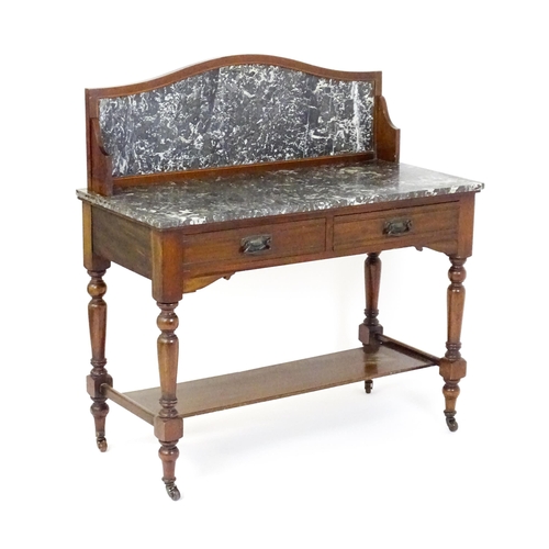 1727 - A late 19thC / early 20thC washstand, with a marble splashback and matching marble top above two sho... 