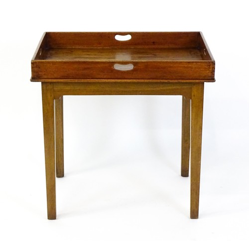 1739 - A 19thC mahogany occasional table with a butlery tray top, the tray having raised sides with pierced... 