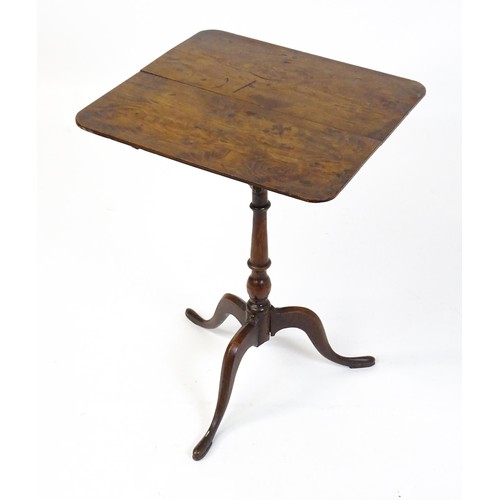 1750 - A late Georgian tripod table with a squared yew wood table top above a turned tapering mahogany pede... 