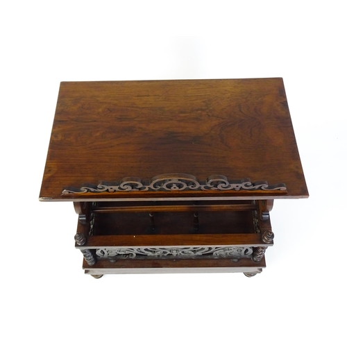 1527 - An early / mid 19thC rosewood Canterbury with a rectangular figured top above lyre shaped supports a... 