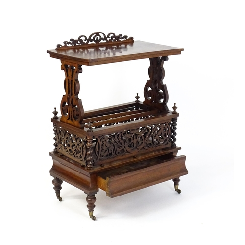 1527 - An early / mid 19thC rosewood Canterbury with a rectangular figured top above lyre shaped supports a... 