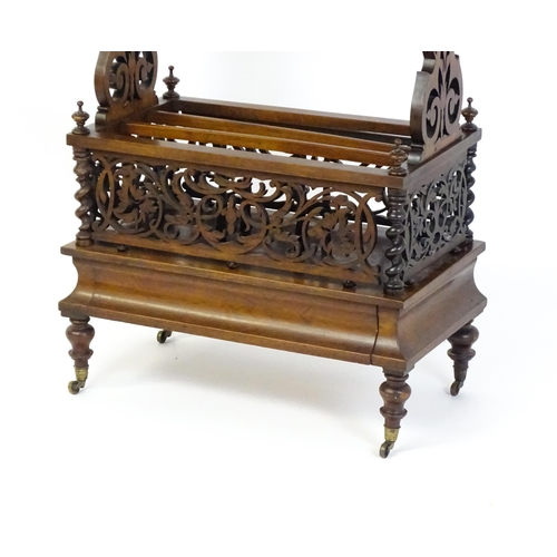 1527 - An early / mid 19thC rosewood Canterbury with a rectangular figured top above lyre shaped supports a... 