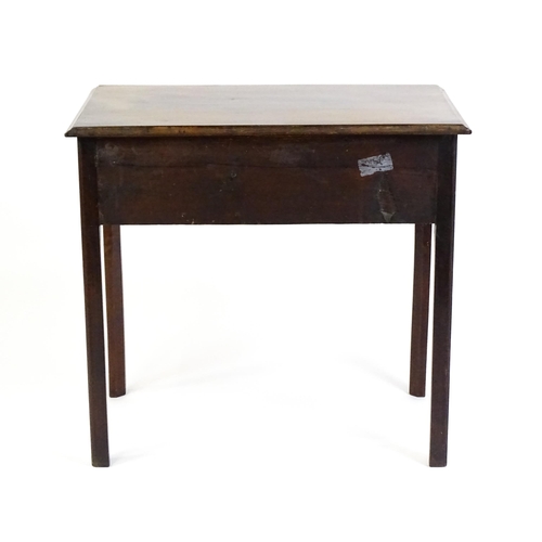 1528 - A Georgian mahogany lowboy with a moulded top above three short drawers and raised on four chamfered... 